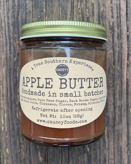 Old-fashioned apple butter in glass jar with rustic label