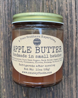 Old-fashioned apple butter in glass jar with rustic label